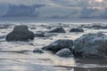 Moody grey seascape background, rock in the Irish Sea at Seascale beach, Cumbria, England, United Kingdom Royalty Free Stock Photo