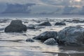 Moody grey seascape background, rock in the Irish Sea at Seascale beach, Cumbria, England, United Kingdom