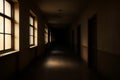 Moody Interior View of a Long Corridor in an Old, Darkened Building Royalty Free Stock Photo