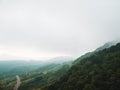 Moody landscape: hilly terrain covered in clouds and fog