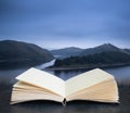 Moody landscape image of lake pre-dawn in Autumn with haunting feel in pages of imaginary reading book