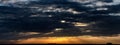 Moody panoramic cloudscape at sunset