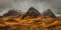 A moody panoramic of the Three Sisters mountains in Glencoe. Scotland Royalty Free Stock Photo