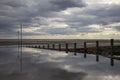 Moody reflections on Chalkwell Beach, Essex, England, United Kingdom