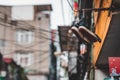 Moody shot of shoes hanging outside an apartment building in a typical Asian city such as in Japan, Vietnam or China