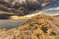 Moody skies over the lighthouse at Ile Rousse in Corsica Royalty Free Stock Photo