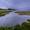 Moody sky with clouds and morning fog above lake in Scottish Highlands Royalty Free Stock Photo