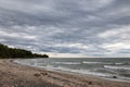 Moody stormy gray clouds over the sandy beachfront shore of Lake Erie at Wendt Beach Park, New York, USA