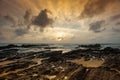 Dramatic cloudscape, rocky shoreline, ocean views at dawn, Dungun Terengganu, Malaysia Royalty Free Stock Photo