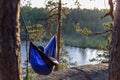 Moody sunset photo of a man in a hammock. Royalty Free Stock Photo