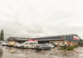 Supermarket, with many vehicles in front in Mooi River