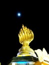 The moon is above the naka with 7 heads on the full moon night of Buddha lent ending