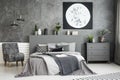Moon art decor on the wall in a stylish grey bedroom interior wi Royalty Free Stock Photo