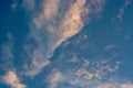 Moon on blue sky with red rare clouds, late evening. Royalty Free Stock Photo
