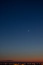 Moon on a bright blue sunset sky, screensaver on the desktop, new moon Royalty Free Stock Photo