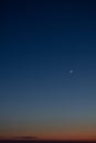 Moon on a bright blue sunset sky, screensaver on the desktop, new moon Royalty Free Stock Photo