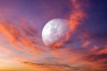 Moon in bright clouds of sunset sun . New moon .  The sky at night with stars. Royalty Free Stock Photo