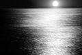 Moon and bright moonlight above the sea horizon Royalty Free Stock Photo