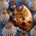 Moon cake with mother pig and piglets in basket, paper lanterns