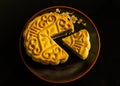 Moon cakes for the Chinese Mid-autumn festival isolated on black background. Royalty Free Stock Photo