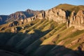 moon casting long shadows over rugged mountain terrain Royalty Free Stock Photo