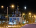 Moon and Church with lights in the winter night. Norilsk