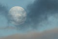 Moon with clouds on a blue gloomy sky, close-up. Beautiful background, beautiful landscape Royalty Free Stock Photo