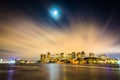 The moon and clouds moving through the sky over the Boston skyline at night, seen from LoPresti Park in East Royalty Free Stock Photo