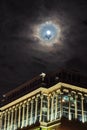 Moon and clouds observing over city Royalty Free Stock Photo