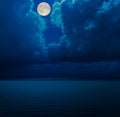 Moon in clouds over sea Royalty Free Stock Photo