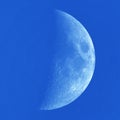 Moon details and clouds on blue sky Royalty Free Stock Photo