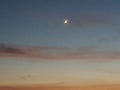 A Moon, Golden and Pink Clouds in the evening