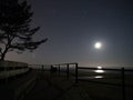 Moon light and stars gamini constellation over Baltic sea