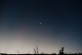 Moon with lonely star in the sky at mountain. Royalty Free Stock Photo