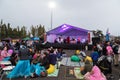 A crowd of people watch a Chinese moon festival musical performance