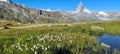 The Moon next to the Matterhorn peak on a sunny day, Switzerland.