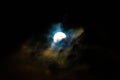 Moon at night covered by clouds carried by the wind. Royalty Free Stock Photo