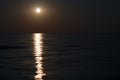 Moon at night, moonlight on the waves of the sea