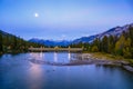 Moon over Banff Avenue Bridge and Bow River in Rocky Mountains, Canada Royalty Free Stock Photo