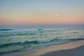 Moon over the Gulf of Mexico at sunrise, in Panama City Beach, Florida Royalty Free Stock Photo