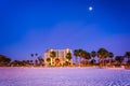 Moon over hotel and the beach at night in Clearwater Beach, Florida. Royalty Free Stock Photo