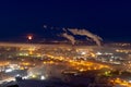 Moon over night industrial city, Norilsk