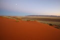 Moon over red Kalahari dune