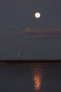 moon over sea at night, reflection of light from celestial body in water. moonlight path Royalty Free Stock Photo