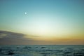 MOON OVER SEA AT SUNSET Royalty Free Stock Photo