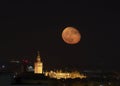 Moon over the sky of Seville with the Cathedral Royalty Free Stock Photo