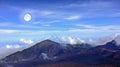 The Moon over volcano mountains - Maui, Hawaii. A photo of the moon over mountains - Maui, Hawaii. Royalty Free Stock Photo