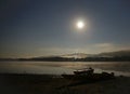 Moon over water at night