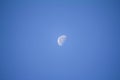 Moon phase warning gibbous in the clear blue sky