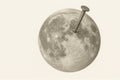 The moon pierced by a nail. Space for text. Royalty Free Stock Photo